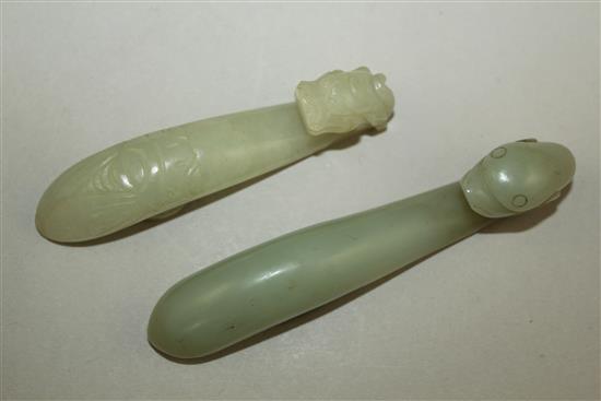 Two Chinese celadon jade belt hooks, 19th century, 11cm